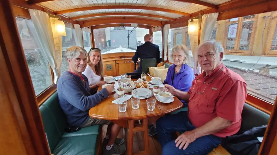 Guests having lunch on a private canal cruise