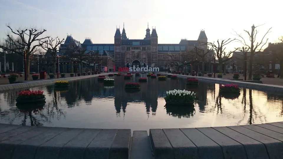 The Rijksmuseum and its reflection from Museumplein