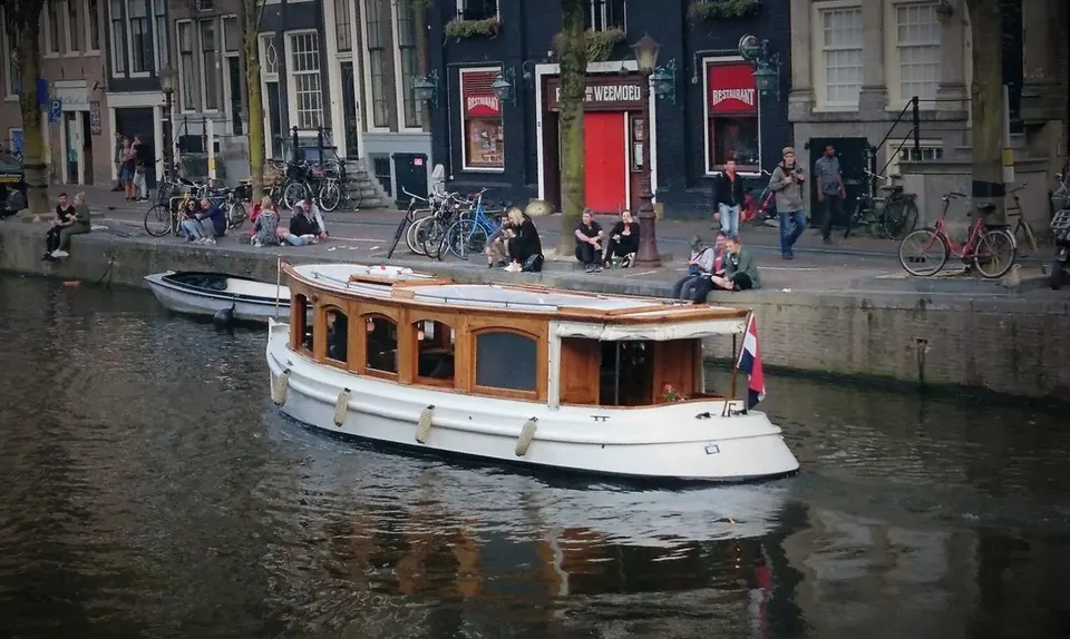 A classic private boat on an Amsterdam canal