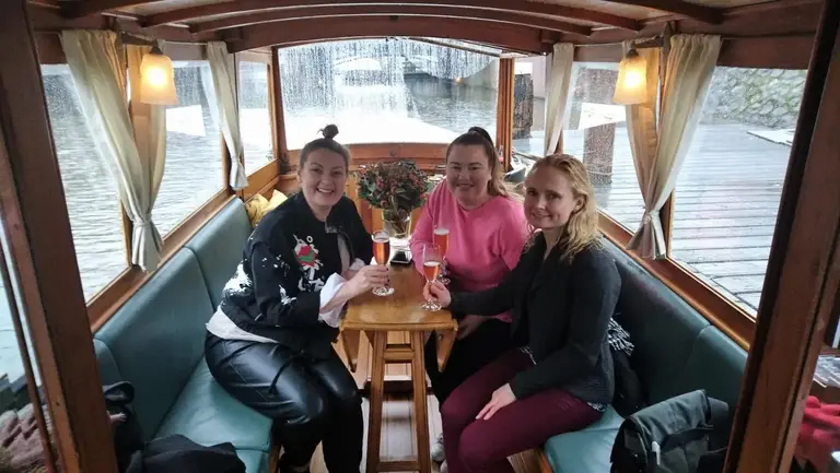 Guests toasting on board a boat