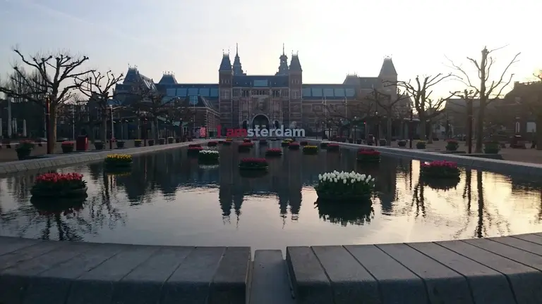 The Rijksmuseum and its reflection from Museumplein