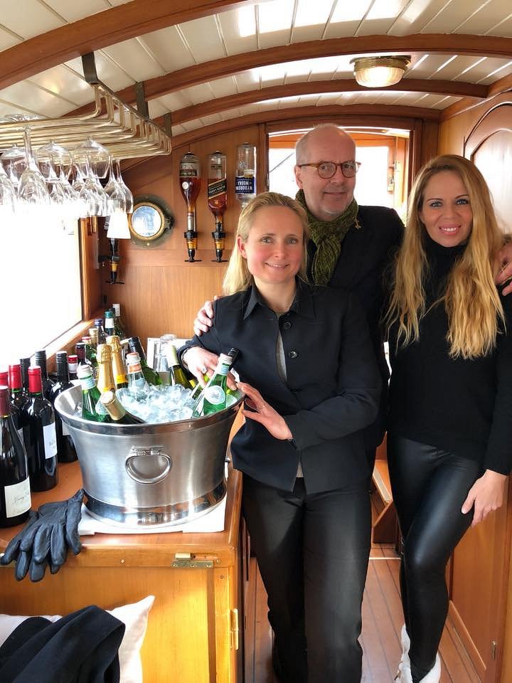 Guests with their private guide aboard a private canal cruise